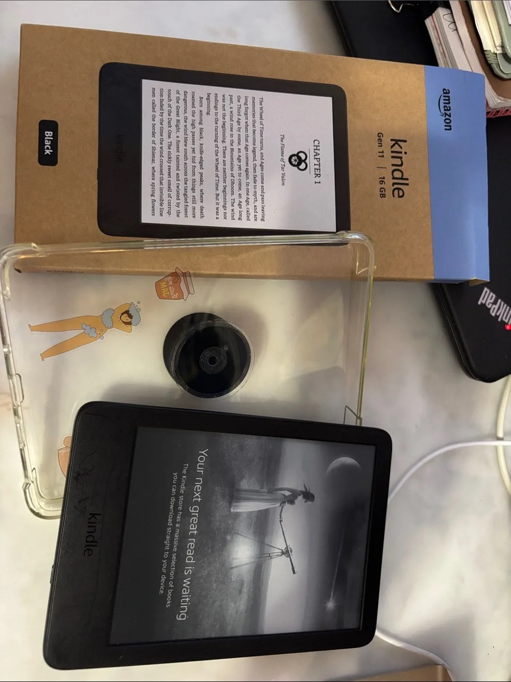 Amazon Kindle Gen 11 16GB E-Reader in Black with a clear case